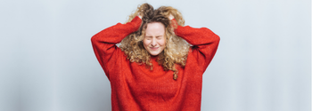 frustrated woman with curly hair